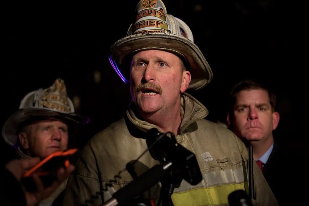Boston Fire Commissioner Joe Finn speaks at the scene of the Beacon Street fire in 2014. (Jesse Costa/WBUR)