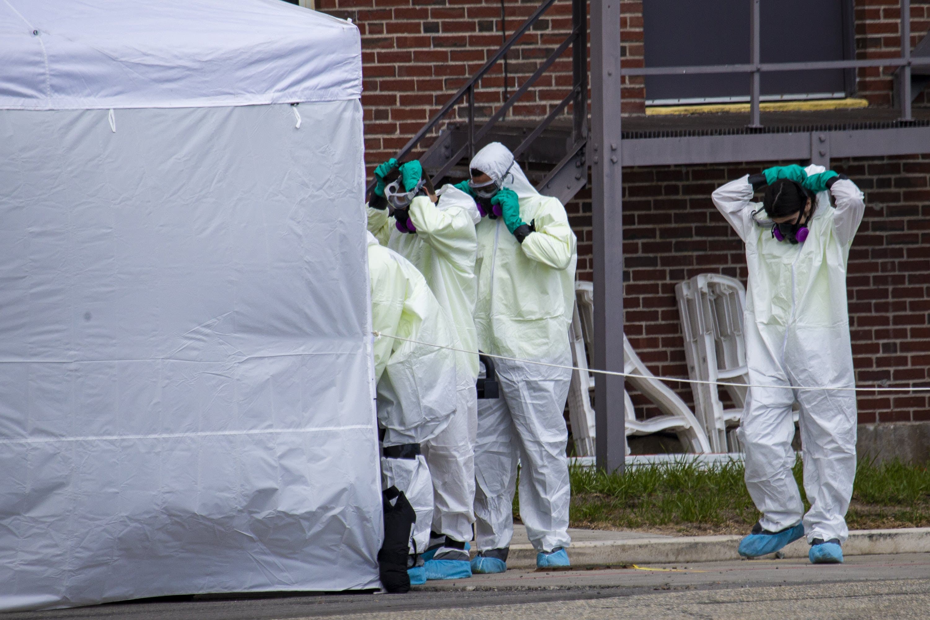 A cleaning crew is suited up with protective gear to enter the Soldiers' Home in Holyoke. (Jesse Costa/WBUR)