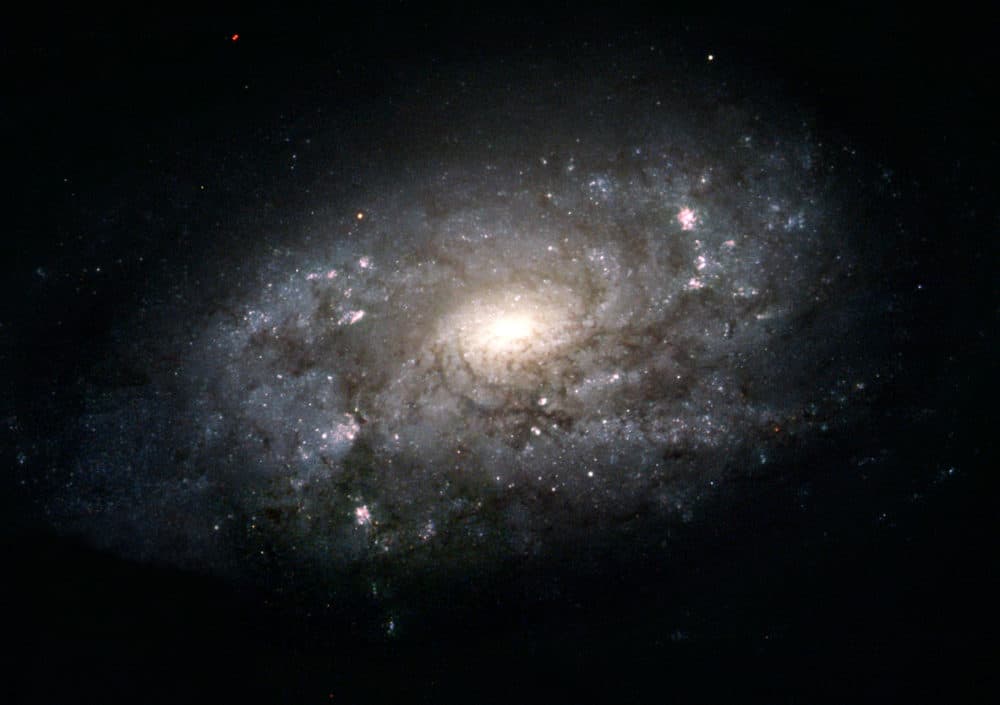 Spiral galaxies like NGC 3949 pictured in this Hubble image, released Thursday Aug. 5, 2004 shows a galaxy that is similar in shape and structure to our home galaxy. Our Sun and solar system are embedded in a broad pancake of stars deep within the disk of the Milky Way galaxy. Even from a distance it is impossible to see our galaxy's large-scale features other than the disk. The next best thing is to look farther out into the universe at galaxies that are similar in shape and structure to our home galaxy. (AP Photo/NASA)