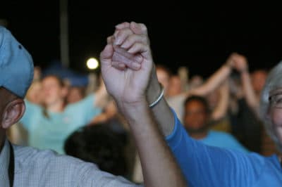 Audience members join hands in worship at the Franklin Graham Decision America event at the Pitt County Fairgrounds in Greenville, N.C. on Wednesday, Oct. 2, 2019. (AP Photo/Chris Seward)