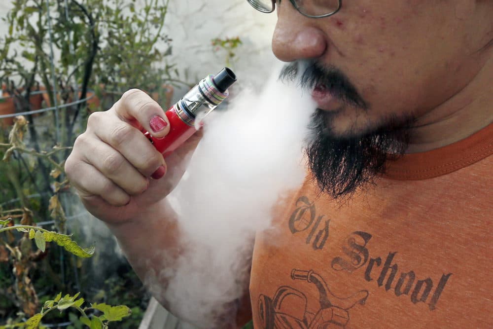 Some physicians are speculating that vaping could make some young people more susceptible to the worst complications. (Jim Mone/AP)