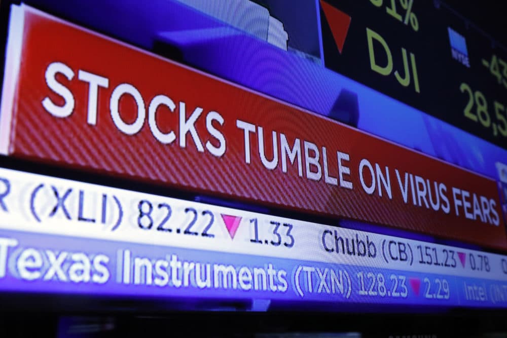 A television screen headlines trading on the floor of the New York Stock Exchange, Monday, Jan. 27, 2020. (Richard Drew/AP Photo)