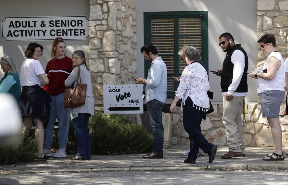 In this Friday, Feb. 28, 2020 photo, voters wait in line at an early polling site in San Antonio, Texas. (Eric Gay/AP)