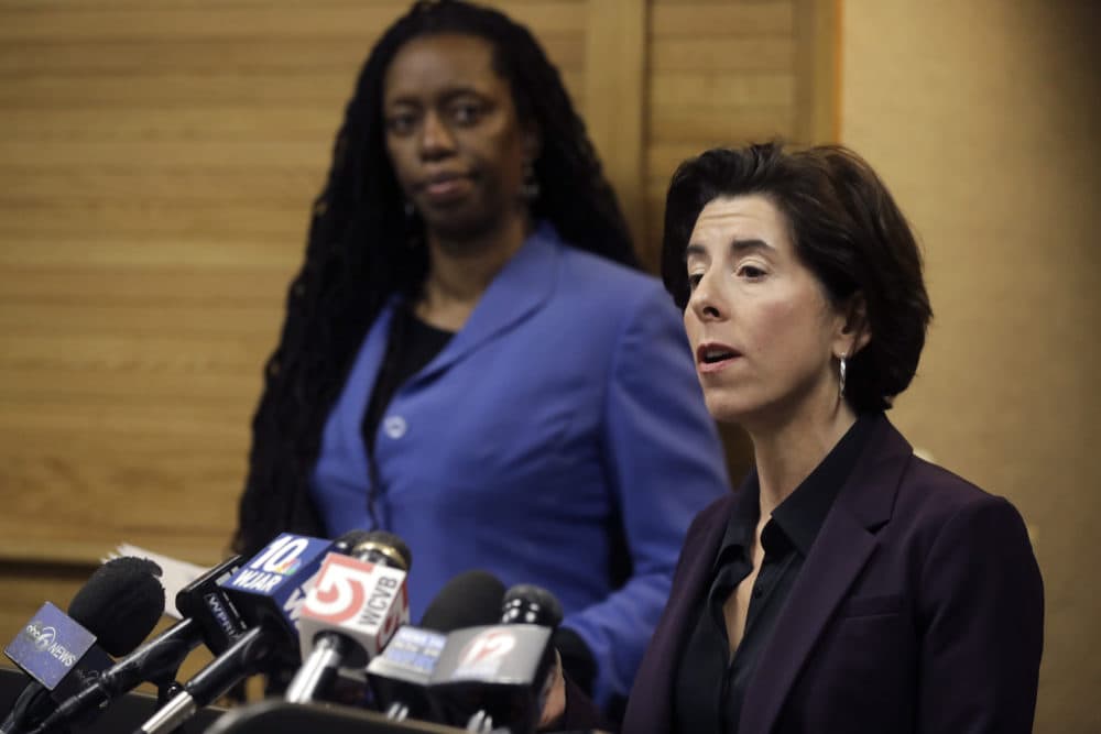 Rhode Island Gov. Gina Raimondo, right, and R.I. Director of Health Nicole Alexander-Scott, behind left, during a news conference about what officials described as the state's first presumptive positive case of the disease caused by the novel coronavirus. (AP Photo/Steven Senne)