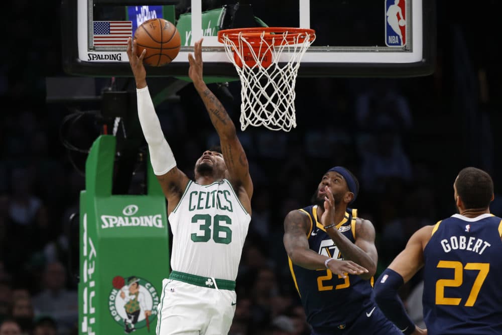 Boston Celtics' Marcus Smart (36) goes to the basket past Utah Jazz's Royce O'Neale during the first quarter of an NBA basketball game Friday, March 6, 2020, in Boston. (Winslow Townson/AP)