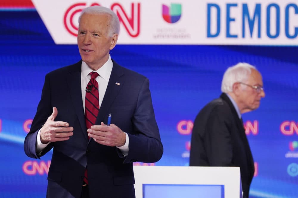 Sen. Bernie Sanders, I-Vt., right, and former Vice President Joe Biden, left, return to the stage after a commercial break in a Democratic presidential primary debate at CNN Studios, Sunday, March 15, 2020, in Washington. (Evan Vucci/AP)