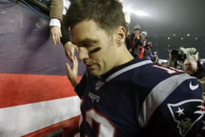In this Jan. 4, 2020, file photo, New England Patriots quarterback Tom Brady shakes hands with a fan as he leaves the field after losing an NFL wild-card playoff football game to the Tennessee Titans in Foxborough, Mass. Tom Brady is an NFL free agent for the first time in his career. The 42-year-old quarterback with six Super Bowl rings said Tuesday morning, March 17, 2020, that he is leaving the New England Patriots. (Bill Sikes/AP)