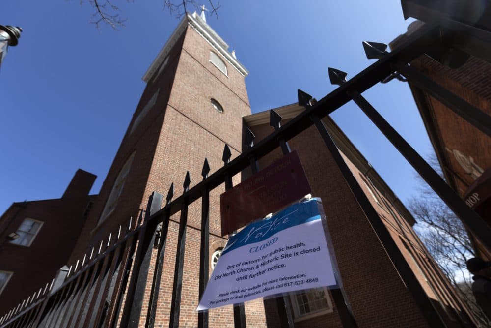 A sign announces the closure of historic Old North Church in Boston, Saturday, March 21, 2020, due to the outbreak of the COVID-19 coronavirus. (AP Photo/Michael Dwyer)