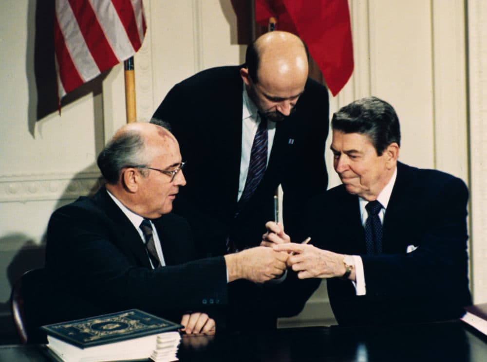 In this Dec. 8, 1987 file photo, President Ronald Reagan, right, and Soviet leader Mikhail Gorbachev exchange pens during the Intermediate Range Nuclear Forces Treaty signing ceremony in the White House. (Bob Daugherty/AP Photo)