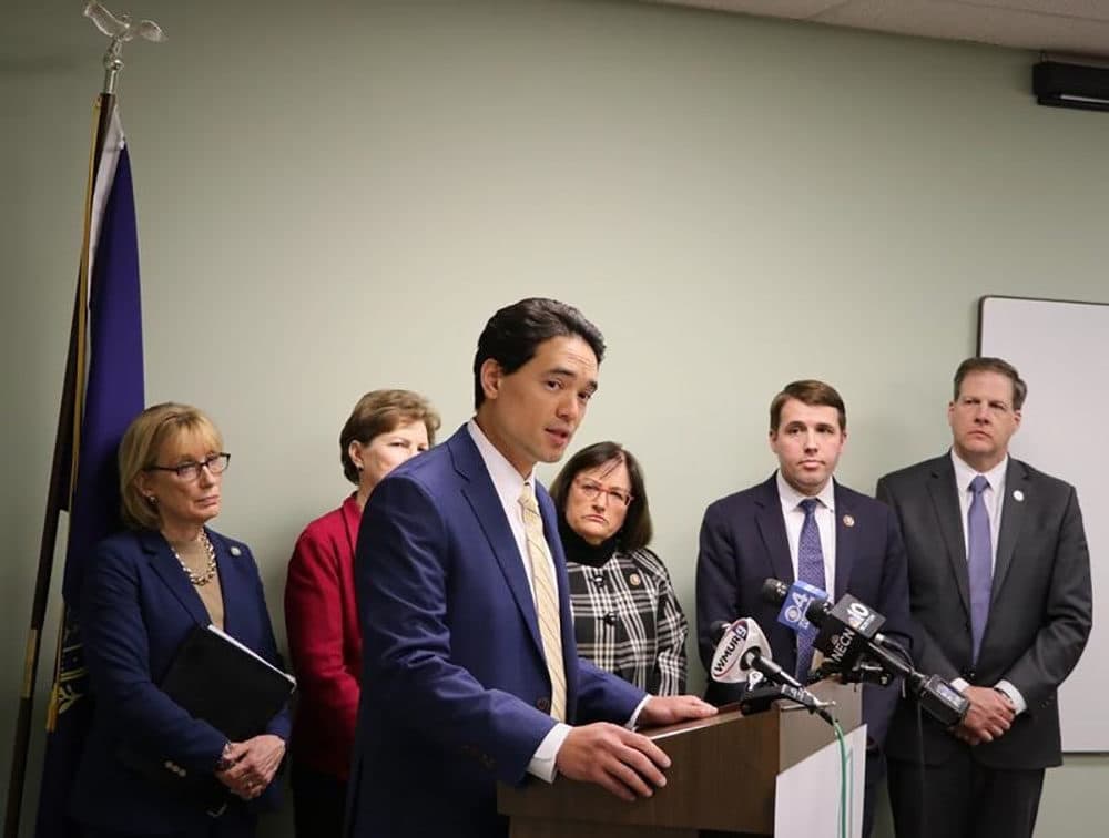 Dr. Benjamin Chan, state epidemiologist, speaks about the first confirmed case of coronavirus in N.H., flanked by Governor Sununu and the congressional delegation. (Dan Tuohy/New Hampshire Public Radio)