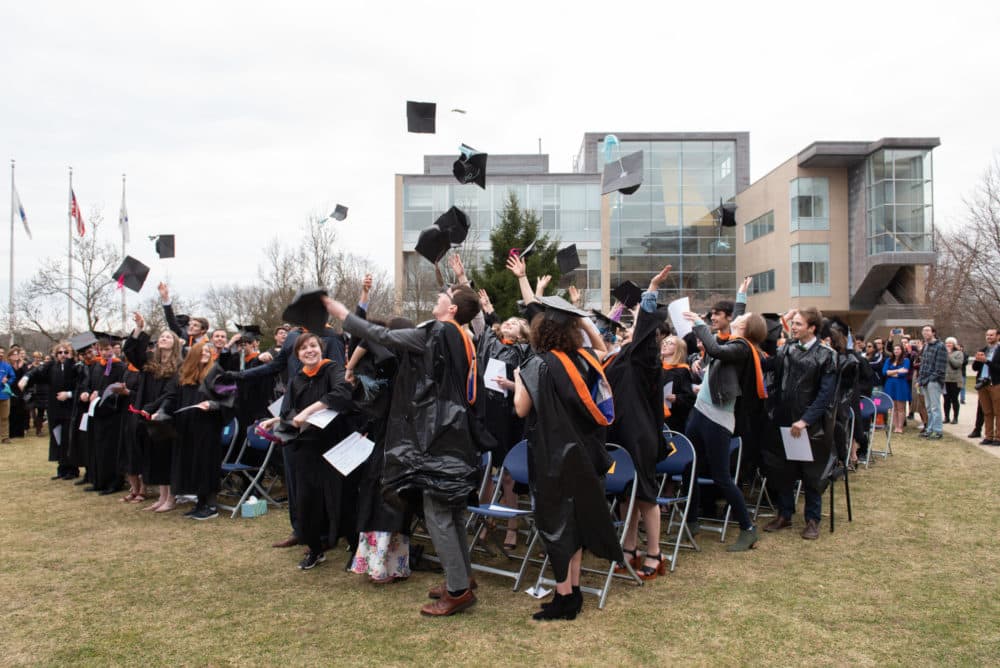 Olin College graduates throw their caps in their air at a faux-Commencement ceremony. (Leise Jones)