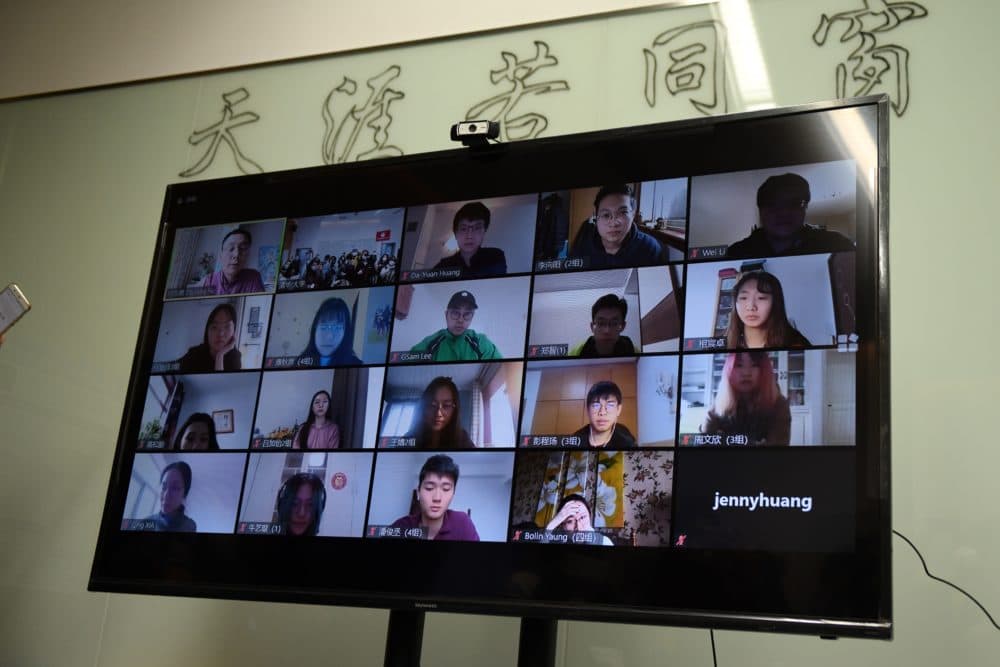 Students are seen on a screen during an online class taken by teacher Fu Zhiyong (top L) at the Academy of Arts and Design at Tsinghua University during a government-organised tour in Beijing on February 28, 2020. (GREG BAKER/AFP via Getty Images)