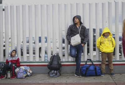 Honduran migrants wait in line to plead their asylum cases at the El Caparral border crossing on March 2, 2020 in Tijuana, Mexico. (Sandy Huffaker/Getty Images)