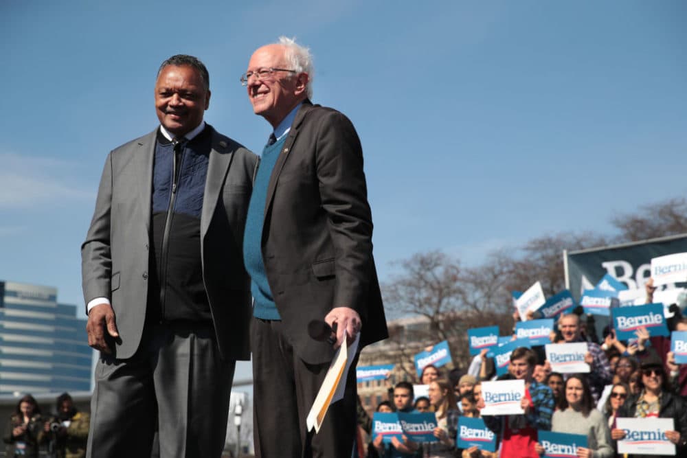 Sen. Bernie Sanders and Rev. Jesse Jackson greet the crowd during a campaign rally in Grand Rapids, Michigan. (Scott Olson/Getty Images)