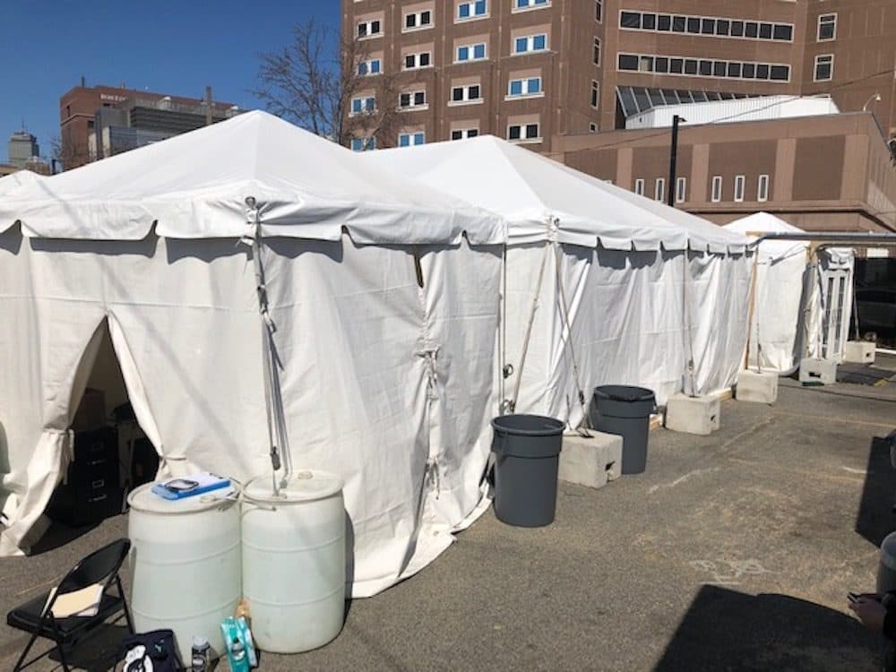 Boston Health Care for the Homeless Program set up tents to quarantine and isolate people who may have COVID-19. (Martha Bebinger/WBUR)