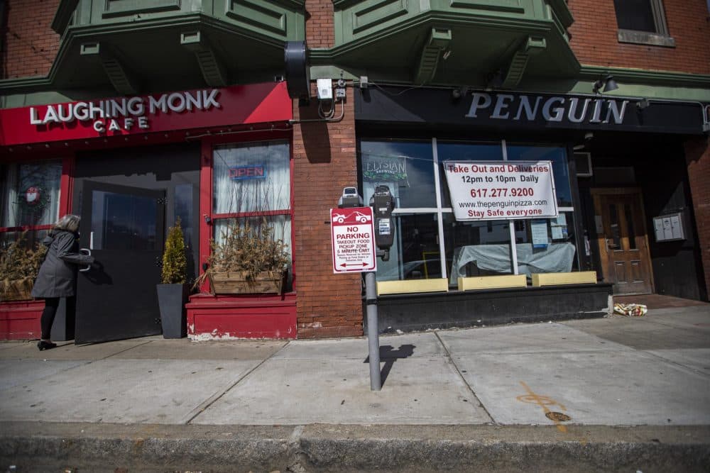 Five-minute food pickup areas have been designated throughout Boston. This one outside the Laughing Monk Cafe and Penguin on Huntington Avenue. (Jesse Costa/WBUR)