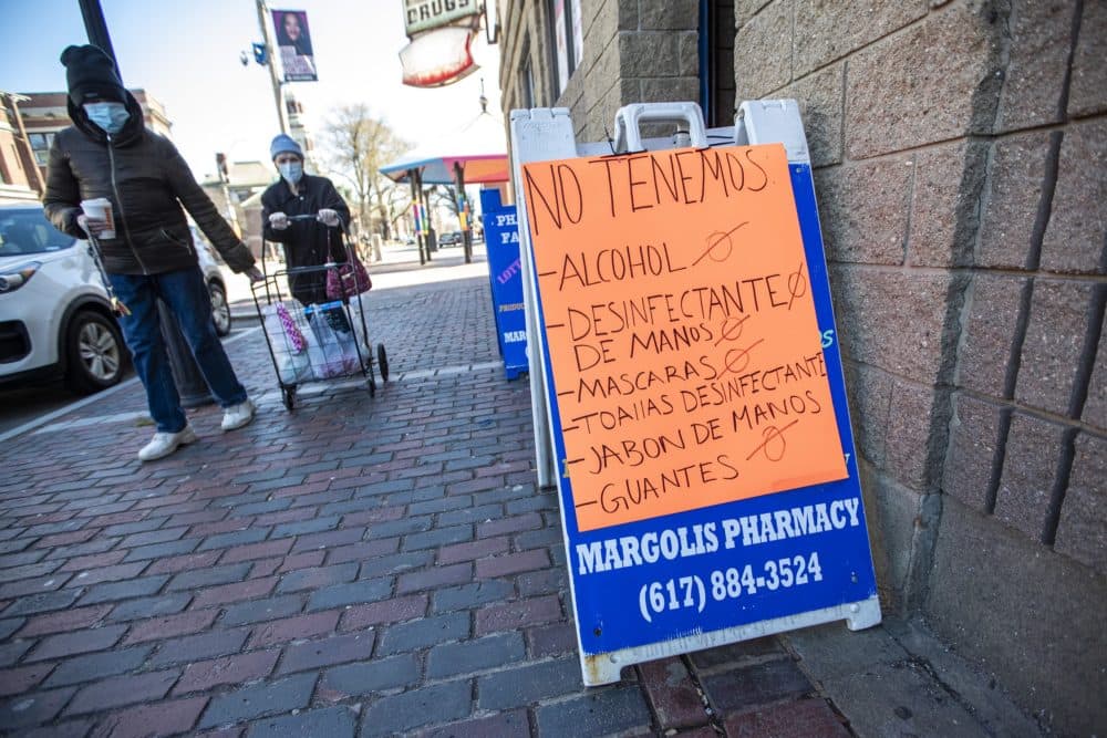 A sign at Margolis Pharmacy in Chelsea indicating, in Spanish, they do not have many of the items necessary for people to combat the COVID-19 pandemic, April 7, 2020. (Jesse Costa/WBUR)