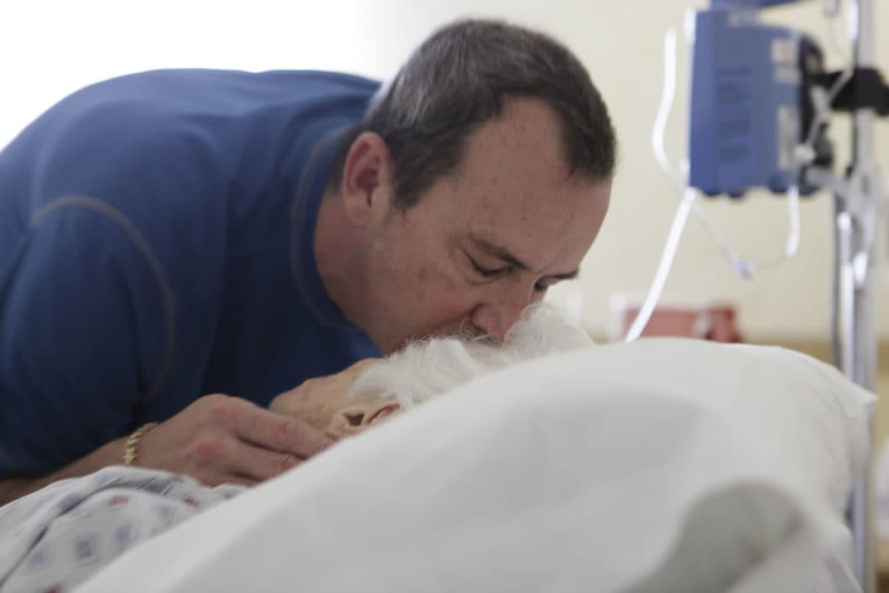 Visits from loved ones are more difficult, if not impossible, and keeping a dying patient comfortable at home can be more challenging. (J Pat Carter/AP)