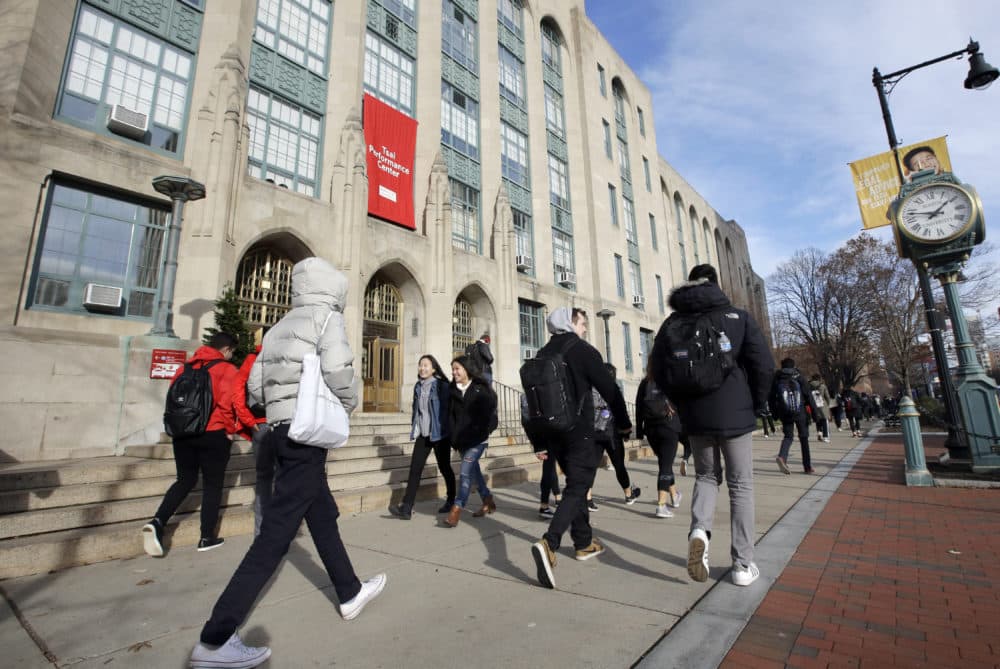 In this Thursday, Nov. 29, 2018, photo students and passers-by walk past an entrance to Boston University College of Arts and Sciences (Steven Senne/AP File Photo)