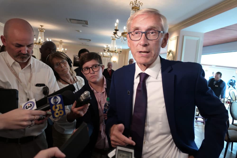 Wisconsin Gov. Tony Evers speaks with reporters at an event in Madison, Wis., last year. (Scott Bauer/AP)
