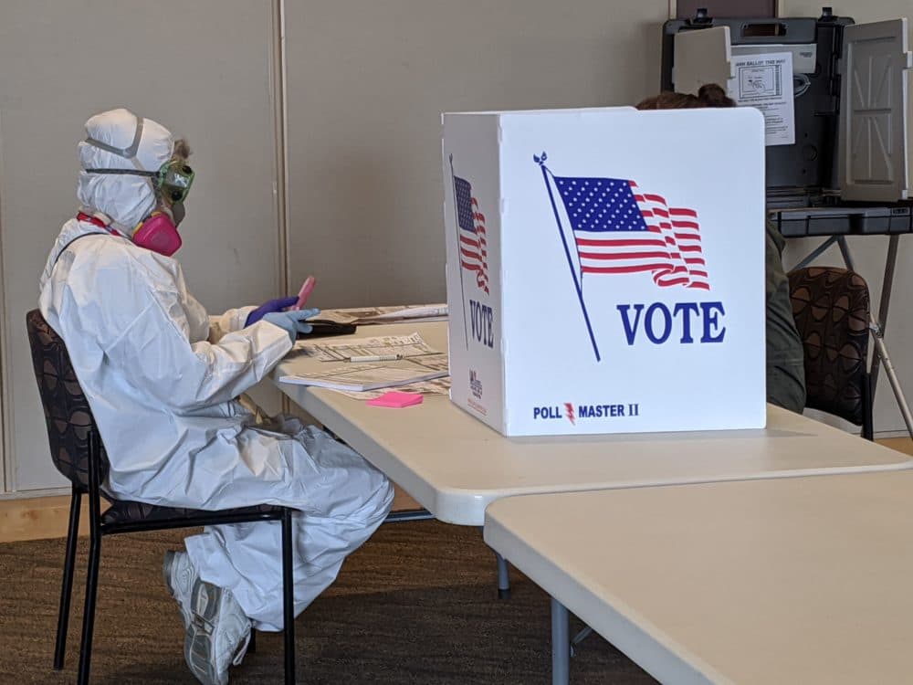 Elections Chief Inspector Mary Magdalen Moser runs a polling location in Kenosha, Wisconsin, in full hazmat gear as the Wisconsin primary kicks off despite the coronavirus pandemics on April 7, 2020. (DEREK R. HENKLE/AFP via Getty Images)