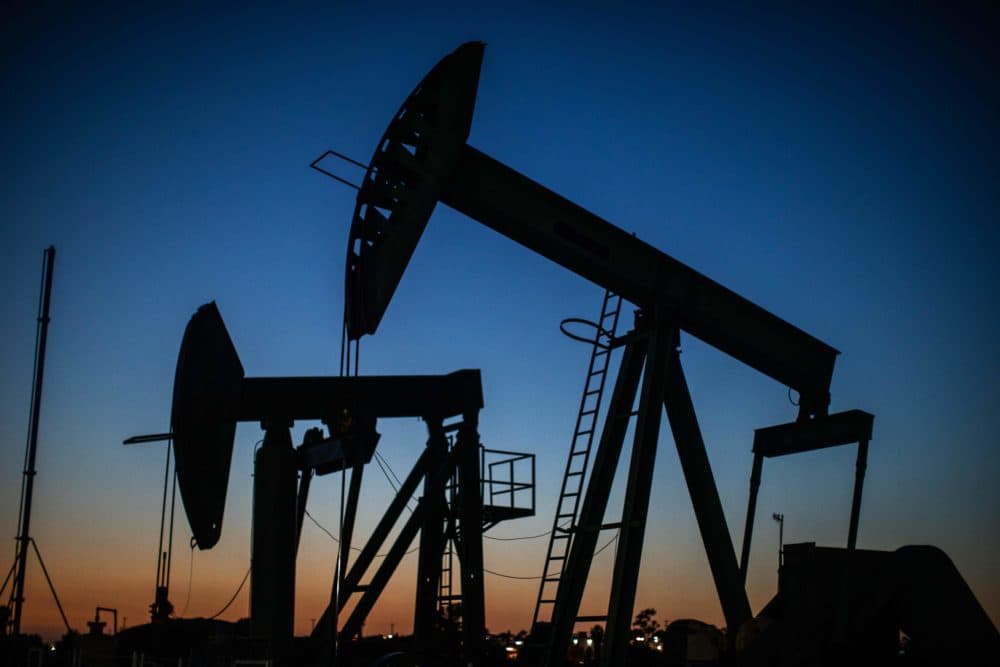 Oil pumpjacks operate at dusk Willow Springs Park in Long Beach, California on April 21, 2020, a day after oil prices dropped to below zero as the oil industry suffers steep falls in benchmark crudes due to the ongoing global coronavirus pandemic. (APU GOMES/AFP via Getty Images)