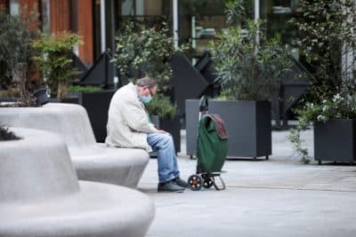 A man sits in Milan, Italy during the coronavirus emergency in April 2020. (Fratma Marka/Universal Images Group via Getty Images)