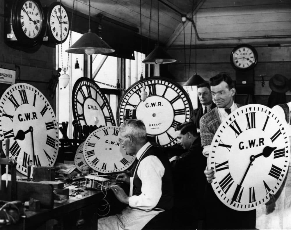 Time keepers: A group of employees at the Great Western Railway's signal works in Reading, test and repair some of the company's many clocks. (Photo by Harry Todd/Getty Images)