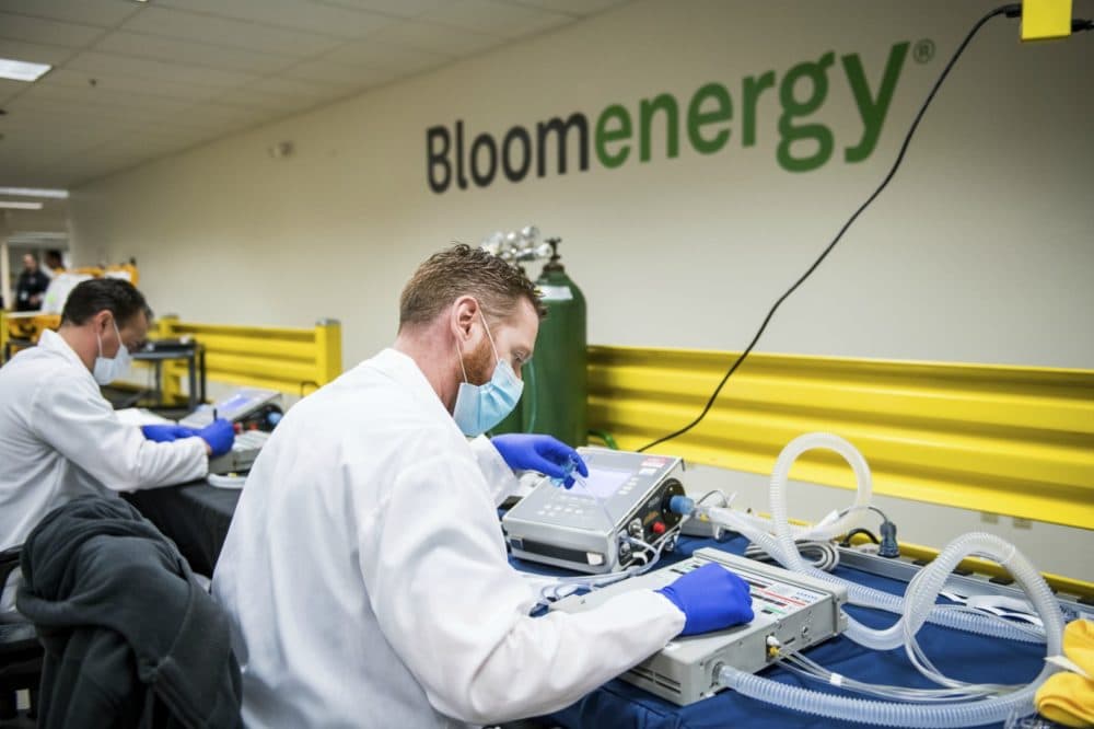 Alex Hawks, a biomedical technician with Cure Biomedical, tests ventilator functionality at Bloom Energy in Sunnyvale, Calif., Saturday, March 28, 2020. (Beth LaBerge/Pool Photo via AP)