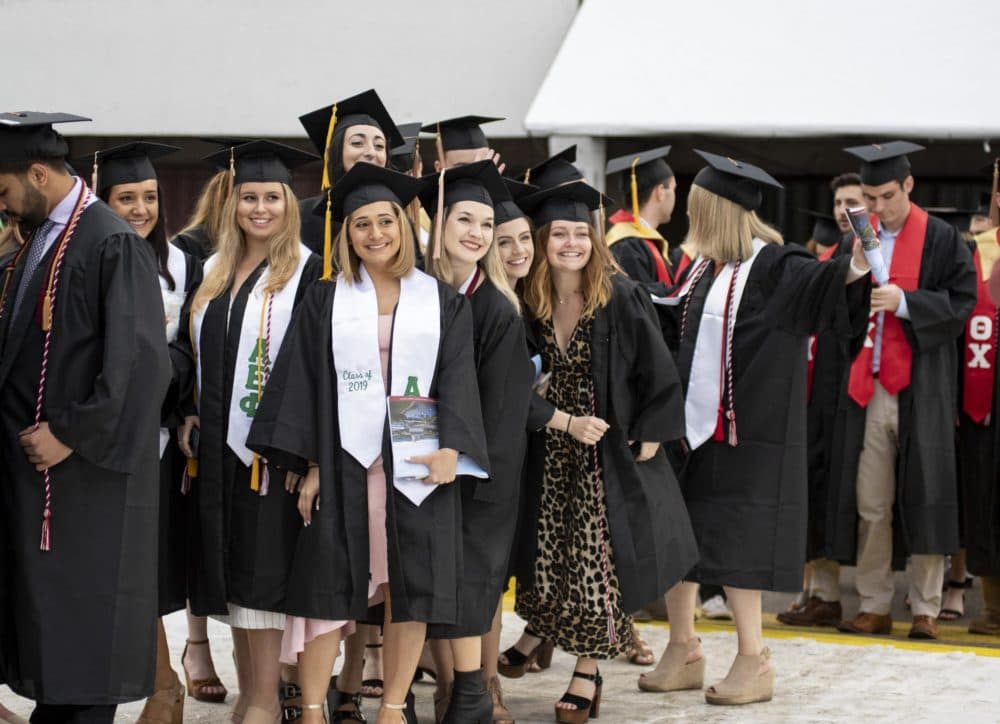 Graduates from UMass Amherst in 2019 line up for commencement exercises. Most May 2020 commencement events in the U.S. were canceled or postponed because of the COVID-19 pandemic. (Courtesy of UMass Amherst via NEPR)