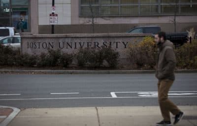 Man walks on Commonwealth Ave. into Kenmore Sq at Boston University in this 2016 file photo. (Jesse Costa/WBUR)
