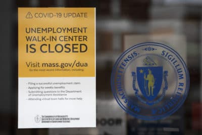 A sign announces the closure of the Massachusetts Unemployment Office, May 9, 2020, in Boston. (Michael Dwyer/AP)