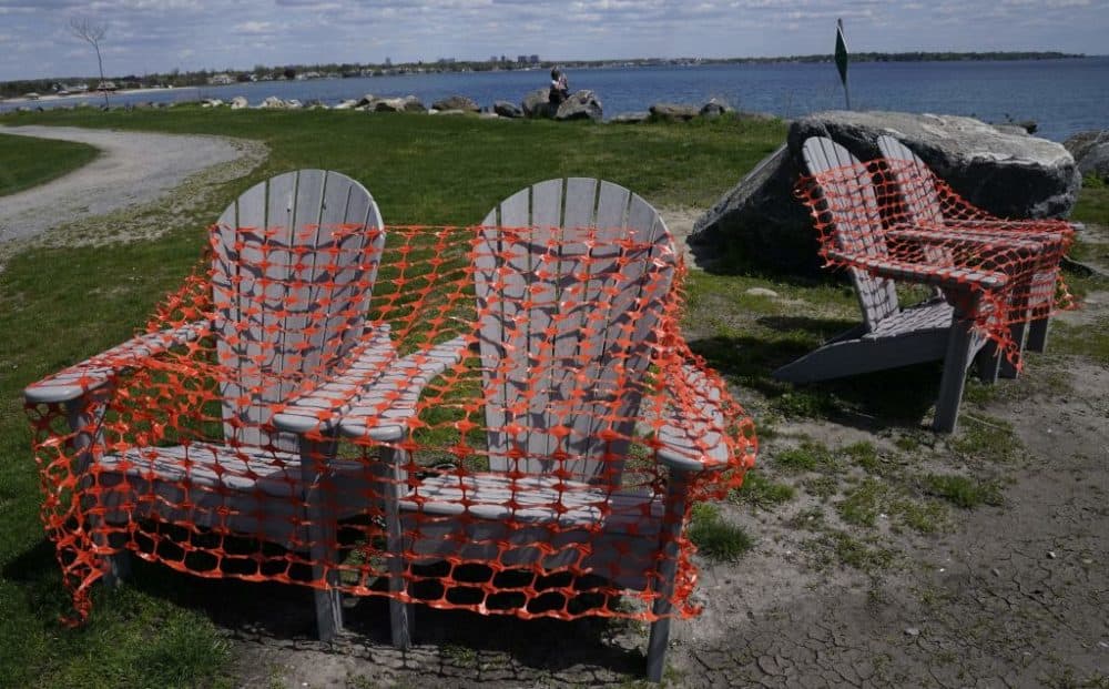 Adirondack chairs are covered in protective mesh on Tod's Point in Old Greenwich, Connecticut, on May 7, 2020. (Timothy A. Clary/AFP/Getty Images)