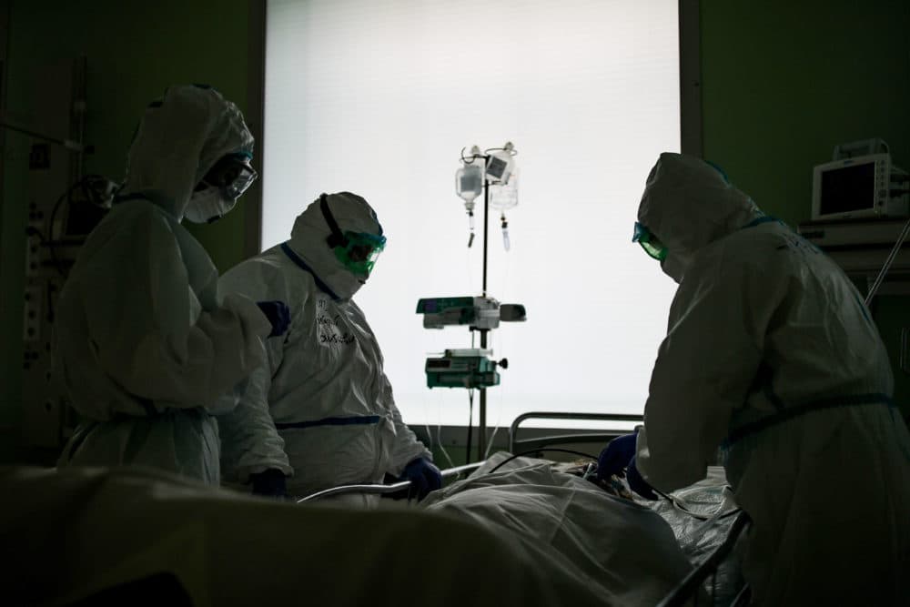 Employees at an intensive care unit of the Federal Clinical Center of Higher Medical Technologies of the Russian Federal Medical Biological Agency  treats COVID-19 patients, patients with suspected coronavirus and patients with viral community-acquired pneumonia. (PSergei Bobylev/Getty Images)
