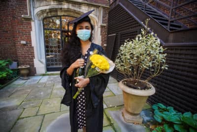 Pakistani student Varsha Thebo, 27, poses on the campus of the International Student House where she resides, on the day of her graduation from Georgetown University in Washington, DC on May 15, 2020. (AGNES BUN/AFP via Getty Images)