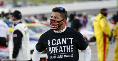 Driver Bubba Wallace wears a Black Lives Matter shirt as he prepares for a NASCAR Cup Series auto race Wednesday, June 10, 2020, in Martinsville, Va. (AP Photo/Steve Helber)