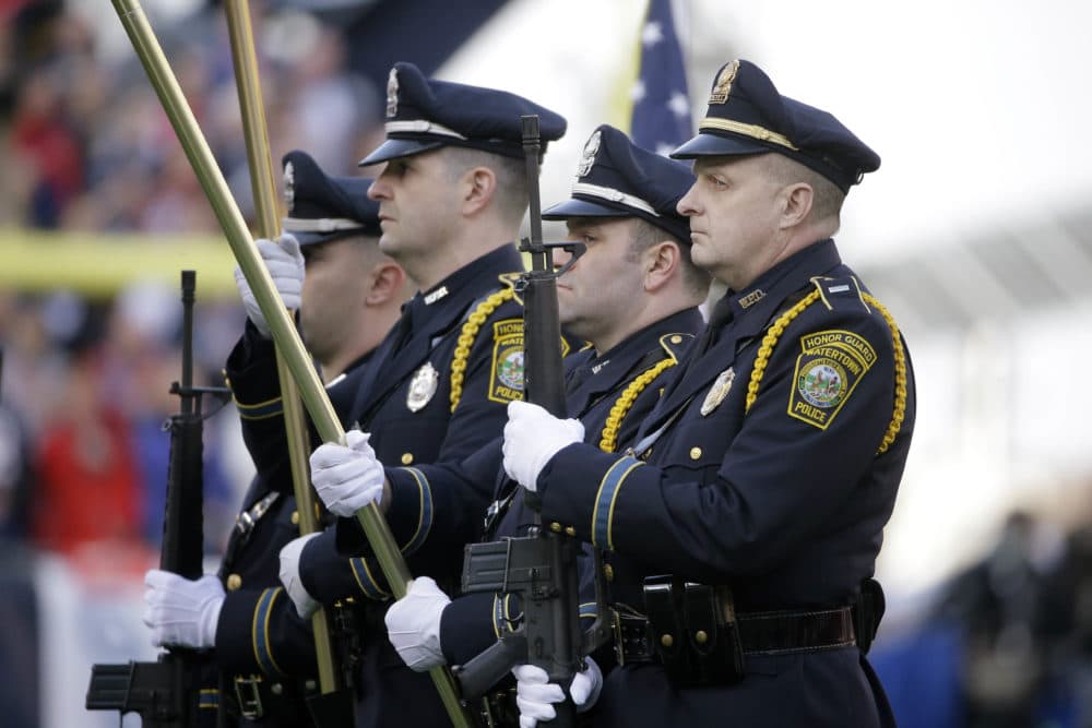 Sports teams have close connections to the police and military. (Steven Senne/AP)