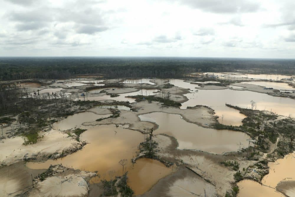 Peruvian jungle devastated by wild cat gold miners is seen from the air in Madre de Dios, Peru, March 5, 2019. Peruvian officials inaugurated the first of four military bases Tuesday where soldiers will use drones and satellite images to protect the Amazon. The unprecedented move comes two weeks after authorities evicted thousands of illegal gold miners blamed with contaminating Amazon lands and rivers with mercury. (Guadalupe Pardo/Pool Photo via AP)