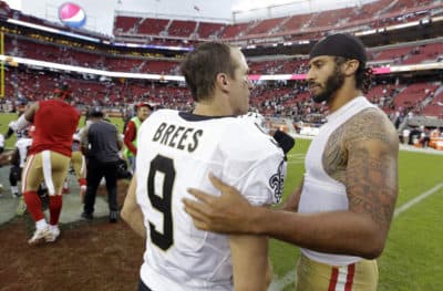 Former San Francisco 49ers quarterback Colin Kaepernick, right, is greeted by New Orleans Saints quarterback Drew Brees at the end of an NFL football game in 2016. Drew Brees has drawn sharp criticism for opposing Colin Kaepernick’s kneeling during the national anthem, and more recently, for similar remarks. (D. Ross Cameron, AP)