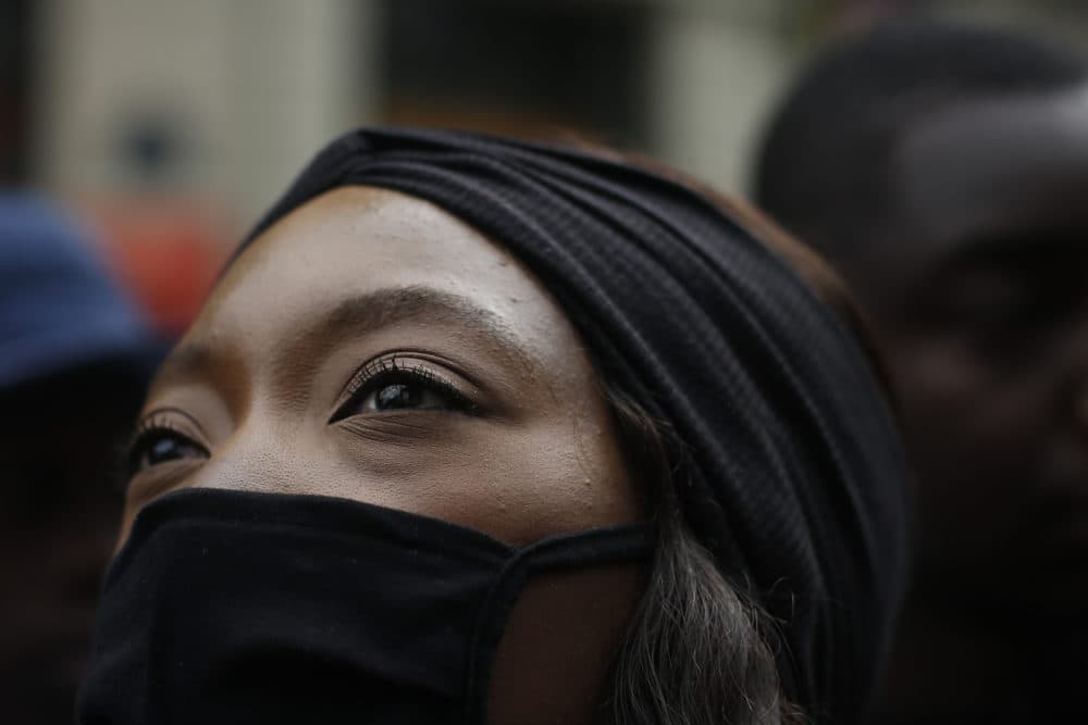 A woman demonstrates against police brutality and racism in Paris, France, Saturday, June 13, 2020, a march organized by supporters of Adama Traore, who died in police custody in 2016 in circumstances that remain unclear despite four years of back-and-forth autopsies. (Thibault Camus/AP)