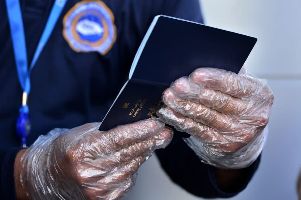 Some countries are considering issuing something called an immunity passport — a document certifying that the person recovered from COVID-19 and now has immunity. (Orlando Sierra/AFP/Getty Images)