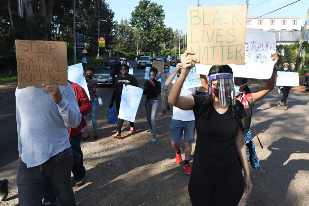 Protesters march during a demonstration in solidarity with the global Black Lives Matter movement as they protest over police brutality and white supremacy in the United States (US), Kenya and globally, outside the US Embassy in Nairobi on June 2, 2020. (Simon Maina/AFP via Getty Images)