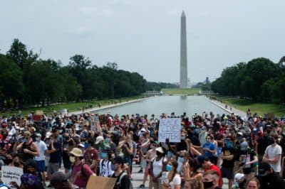 Demonstrators protest at Lincoln Memorial near the Washington Monument (rear) during a protest against police brutality and racism, on June 6, 2020 in Washington, DC. (ROBERTO SCHMIDT/AFP via Getty Images)