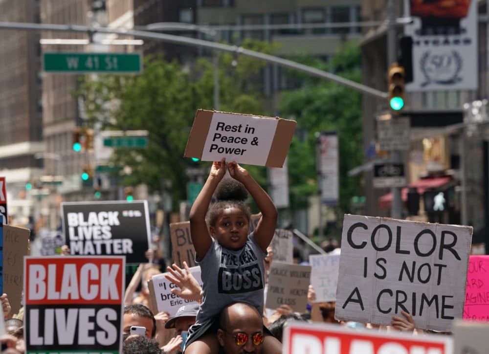 A little girl holds up a sign as &quot;Black Lives Matter&quot; New York protesters demonstrate in Times Square over the death of George Floyd by a Minneapolis police officer. (Bryan R. Smith/AFP/Getty Images)