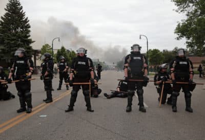 Police officers block a road on the fourth day of protests on May 29, 2020 in Minneapolis, Minnesota. (Scott Olson/Getty Images)