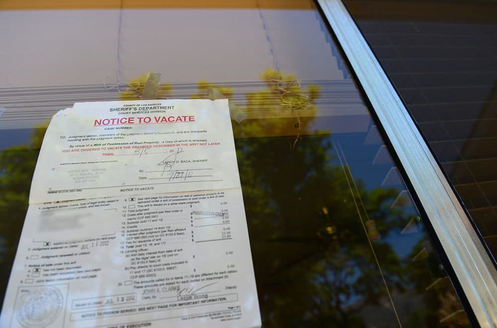 A &quot;Notice to Vacate&quot; is seen in the window of a foreclosed home. (Robyn Beck/AFP/Getty Images)