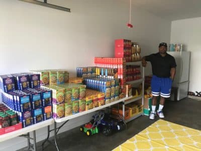 Maurice Humphrey in his garage in Vernon, Conn., where he keeps his stockpile of groceries that he and his volunteers deliver to families in need, all purchased from donated funds from Maurice's &quot;$20 Challenge.&quot; (Courtesy)