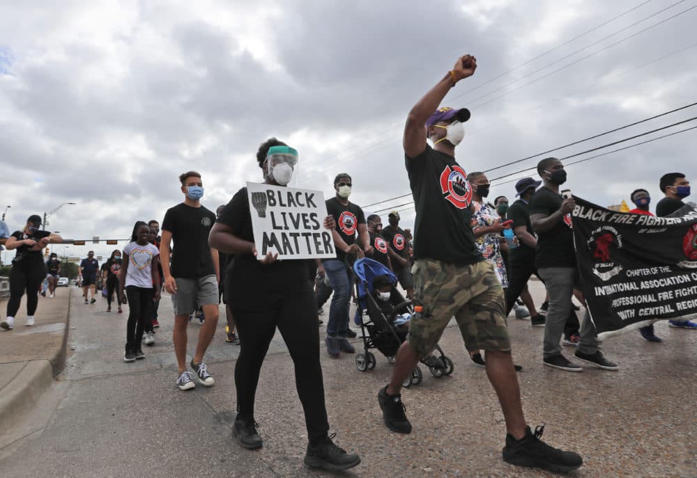 Protesters march in a Black Lives Matter demonstration organized by the Dallas Black Firefighters Association on Juneteenth 2020 in Dallas on June 19, 2020. (LM Otero/AP)
