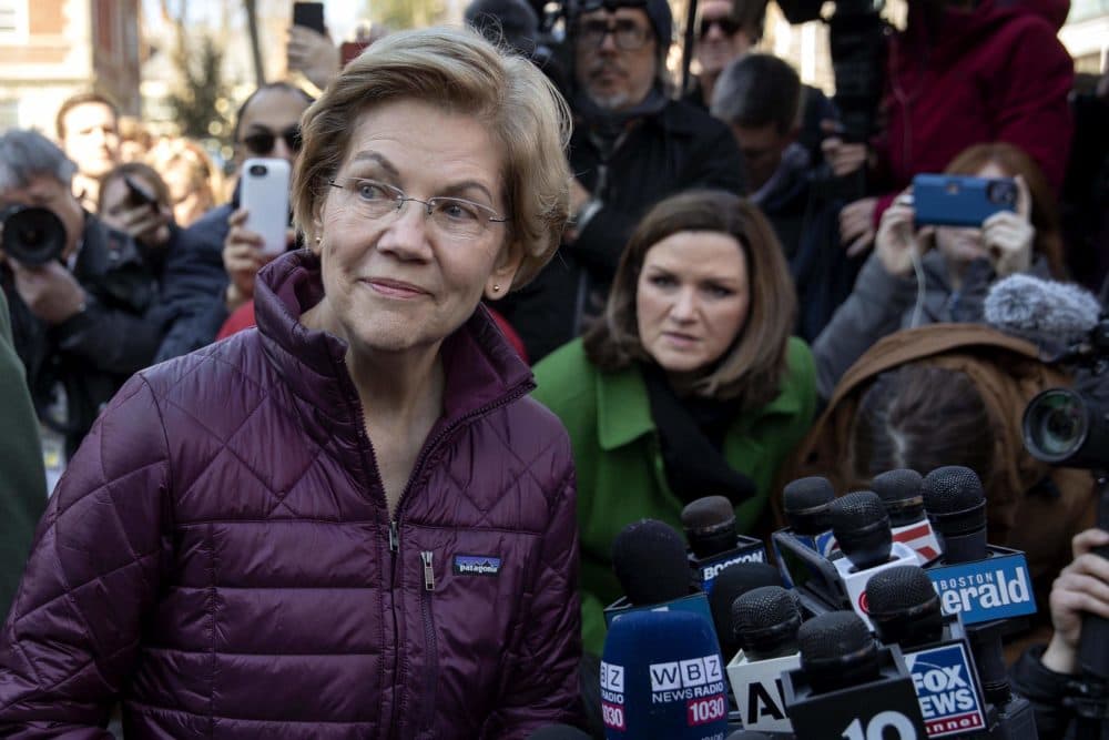 Sen. Elizabeth Warren talks to the press after announcing that she was dropping out of the Democratic presidential race in March. (Robin Lubbock/WBUR)
