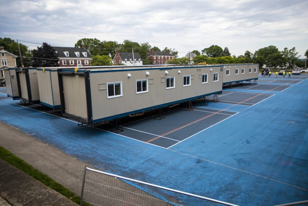Tufts erected temporary isolation spaces on the tennis courts at Fletcher Field, across the street from the President's house. Jesse Costa/WBUR)